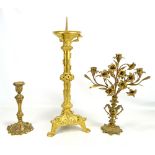 A 19th century gilt metal pricket candlestick with mythical beast and acanthus leaf decoration on