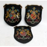 Three reproduction shield armorials with gilt and painted decoration, each approx 66 x 47cm (3).