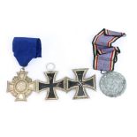 Two Third Reich 1939 Iron Crosses, one with white metal back and stamped L/13 to pin,
