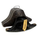 A cased naval officer's bicorn with bullion ribbon and gilt fouled anchor button to front,