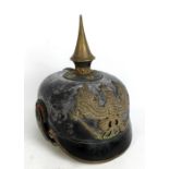 A WWI Prussian Pickelhaube with spike, plate and scale-type finish to chin strap,