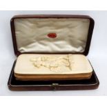 A late 19th/early 20th century ivory and leather manicure wallet,