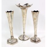 A pair of Edward VII loaded hallmarked silver hexagonal tapering vases, Birmingham 1906 (af),