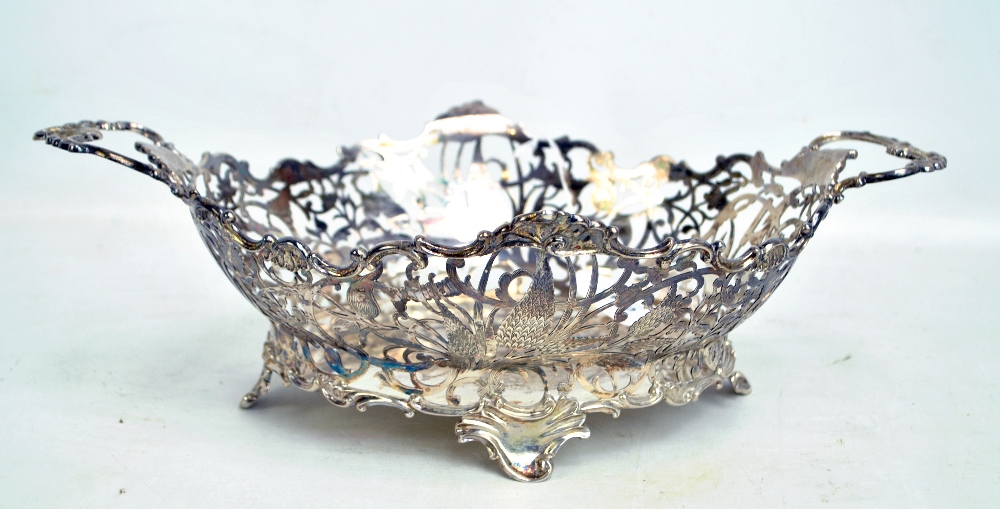 An early 20th century Dutch silver twin handled bowl with floral and scroll pierced sides,