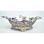 An early 20th century Dutch silver twin handled bowl with floral and scroll pierced sides,