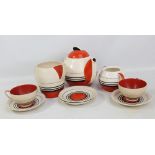 A Susie Cooper design 'Kestrel' shape part tea set comprising a teapot, a milk jug,