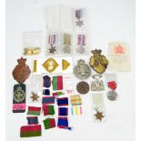 A WWII group of four comprising War and Defence Medals and 1939-45 and France and Germany Stars,
