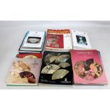 A collection of various Christie's auction catalogues predominantly related to fans and textiles.