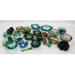 A group of predominantly green tinted glass bowls, shallow dishes, paperweight, ashtrays, etc.