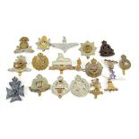 A collection of 20th century military cap badges to include North Stafford,