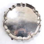 An Elizabeth II hallmarked silver waiter of shaped circular form with piecrust rim,