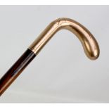 A 9ct yellow gold mounted rosewood walking cane, length 77cm.