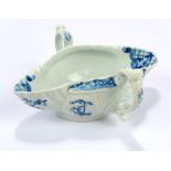 A circa 1770 Worcester porcelain double lipped twin handled sauce boat with finely mould decorated