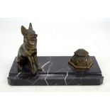 An early 20th century Art Deco style black marble and brass inkstand with pen rest,