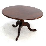 A tilt top occasional table.