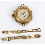 A 14ct yellow gold lady's fob watch with engraved detail and enamelling to the reverse,