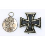A Third Reich 1939 Iron Cross (unmarked) and a 1938 Anschluss medal (2).
