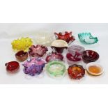 A group of glass pin dishes, shallow bowls and ashtrays.