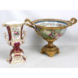 A large French porcelain and gilt metal mounted footed twin handled bowl,