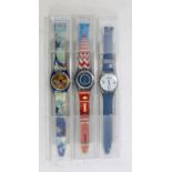 SWATCH; three quartz wristwatches in original plastic cases.