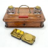 A Victorian oak ink standish with a drawer to one side, length 28cm, and a portable burner (2).