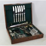 An oak canteen of various cutlery to include Kings pattern knives, etc.