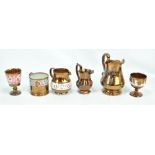 Six copper lustre glazed pieces to include two goblets and a mug (6).