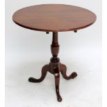 A 19th century oak tilt top table on tripod supports, diameter 69cm (af).