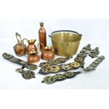 A mixed group of copper and brass including teapot and jugs, numerous horse brasses,