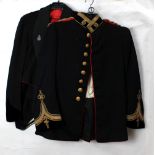 An Indian Medical Service navy dress jacket with gilt trim and badges to collar,