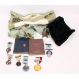 A group of Masonic items including a 15ct yellow gold mounted base metal medal inscribed to reverse