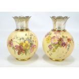 A pair of late 19th century Royal Worcester blush ivory globular vases with hand painted floral