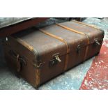 A vintage wood bound canvas covered twin handled travel trunk, 90 x 50 x 30cm.