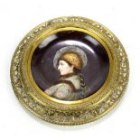 A German Schutz-Marke porcelain hand painted plaque depicting a young female in profile,