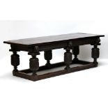 A good 16th century and later oak refectory table, the plank top above gadrooned apron,
