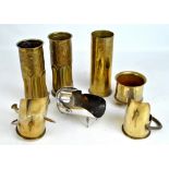 A small group of trench art including three coal scuttles formed from shells,