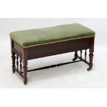 An Edwardian mahogany pad seated hinged top duet stool raised on square sectioned tapering legs to