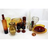 A collection of yellow and pale orange tinted glass including vases, bowls, decanter and stopper,