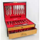 ONEIDA; an eight person 'Hampton Court' cutlery set presented in a bird's eye maple canteen,