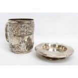 WAKELY & WHEELER; a Victorian hallmarked silver mug embossed with band of cherubic figures,
