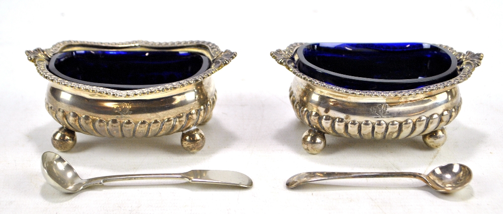 A pair of two large George III hallmarked silver shaped oval open salts with part gadrooned
