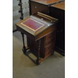 A late Victorian walnut Davenport desk, the lock stamped 'Maple & Co', width 54.5cm.