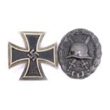 A Third Reich 1939 Iron Cross stamped L/13 to pin and a Third Class Wound Badge (2).