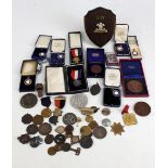 An interesting and varied group of medals and badges with educational including University of