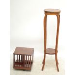 An Edwardian mahogany and inlaid revolving bookcase, height 35.