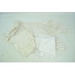 A late 19th/early 20th century lace shawl, length 72cm, and two lace scarves (3).