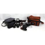 A Pentax 'ME Super' camera in leather case with accessories and manual, in fitted bag,