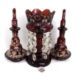 A late Victorian ruby glass table lustre with floral painted decoration, height 24cm,