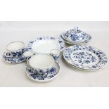 A small collection of Meissen porcelain 'Onion' pattern wares including muffin dish, two plates,