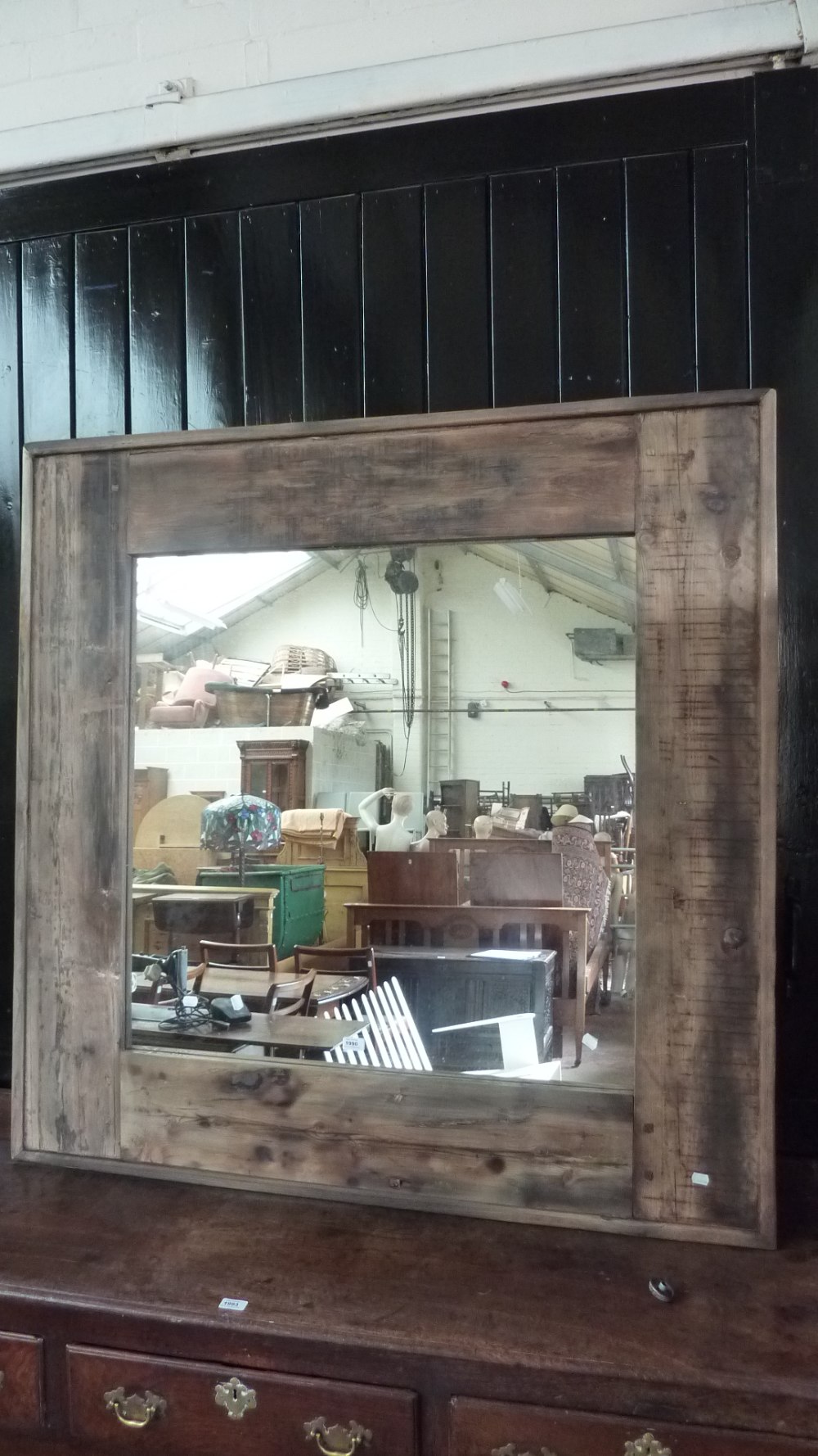 A large rustic pine wall mirror, 136 x 136cm.